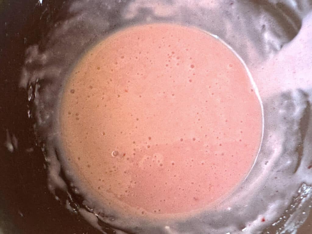 Strawberry glaze in a brown bowl